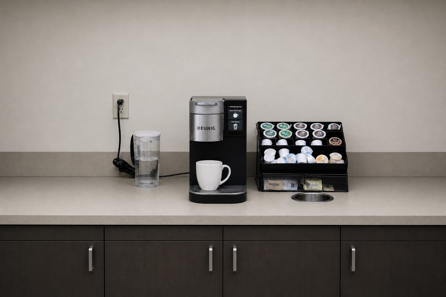 A tired office coffee carafe and pods