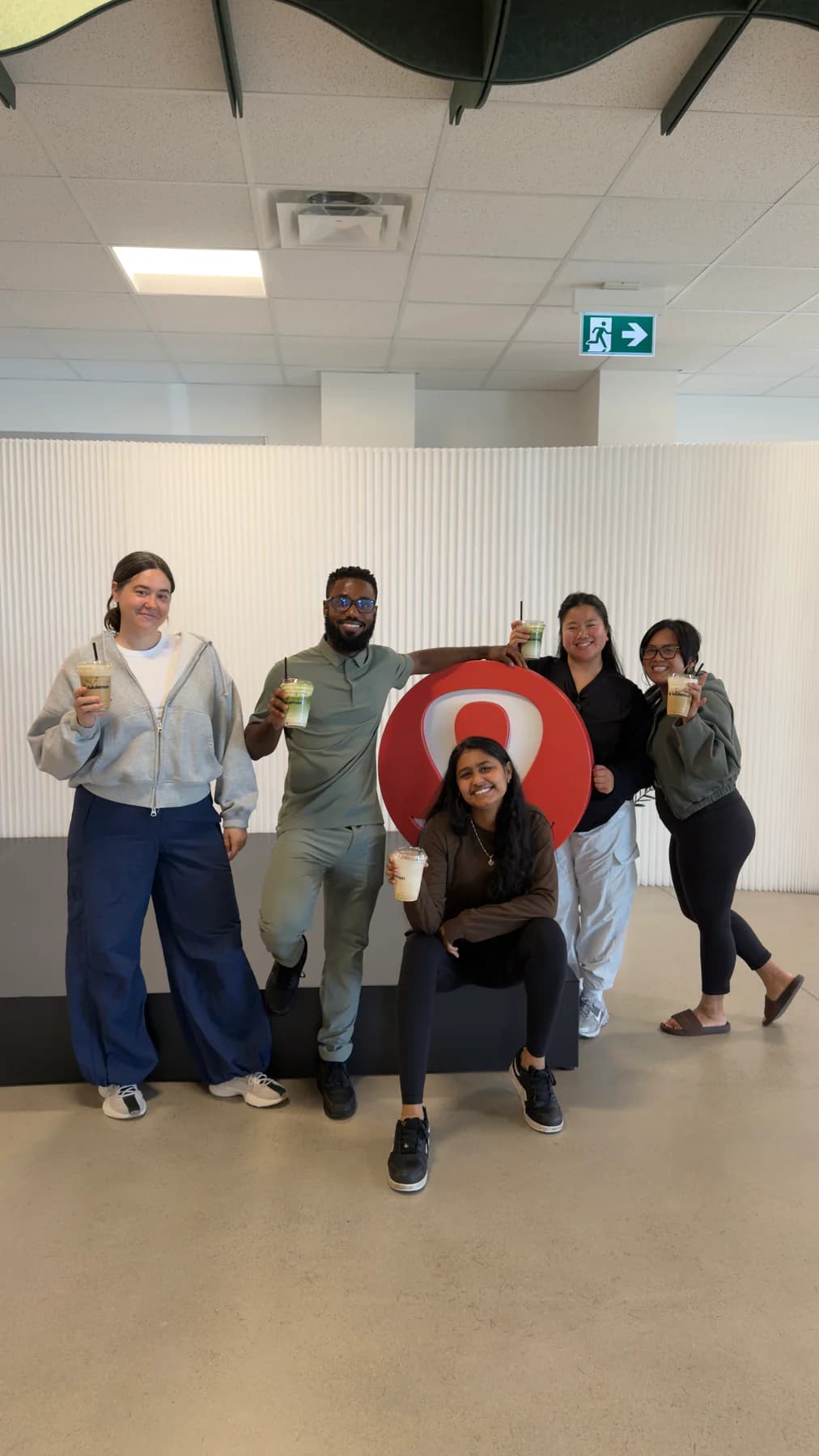 An activation team holding branded drinks