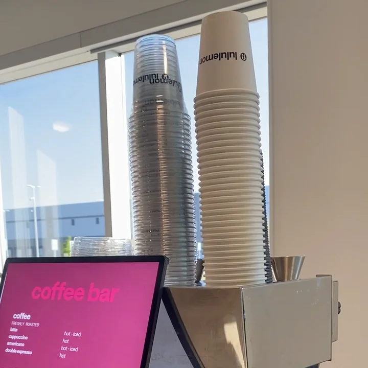 Branded cups and menu displayed at a RoastAroma coffee cart