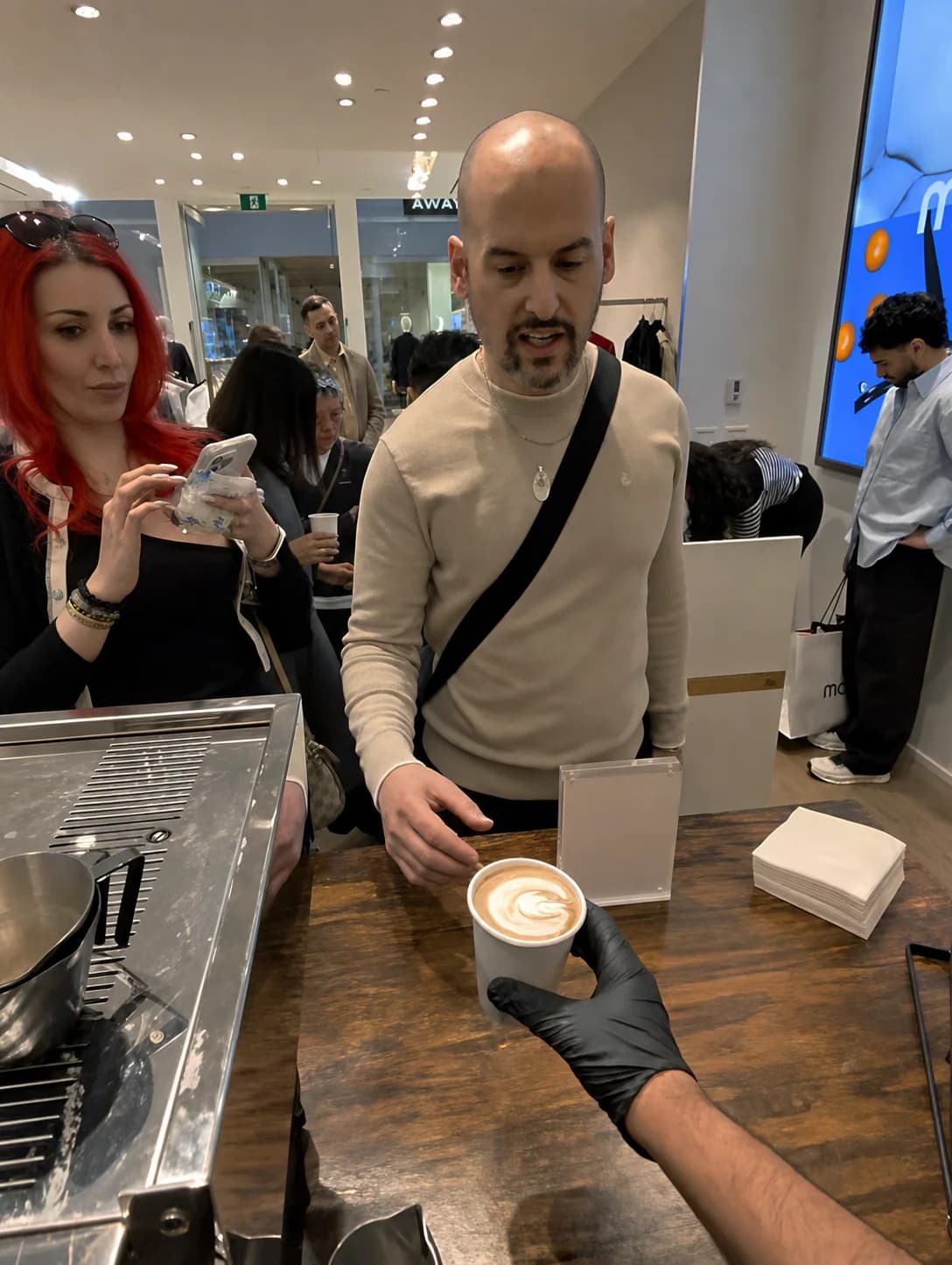 A guest receiving a hot drink during a brand activation