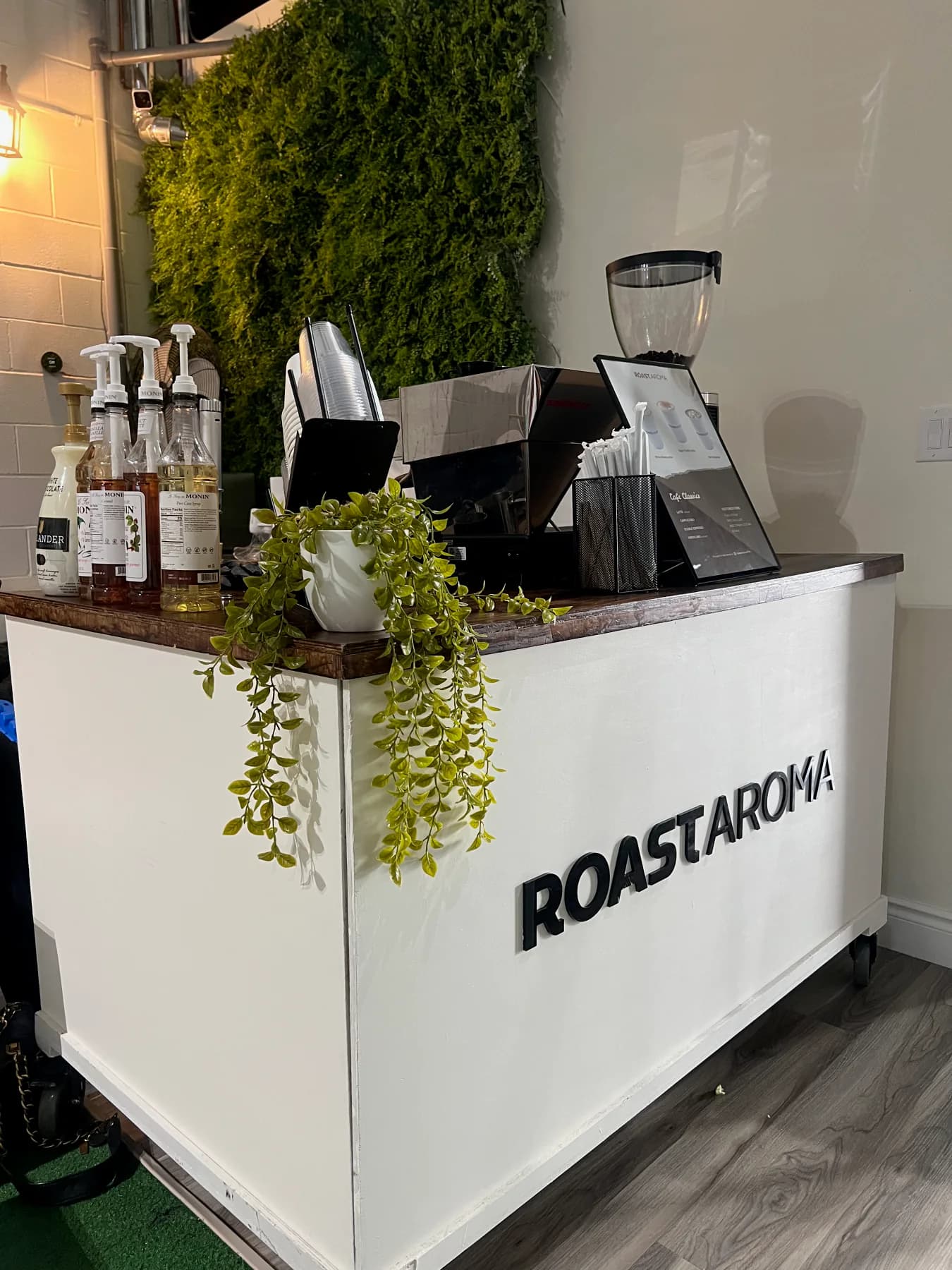 RoastAroma coffee cart positioned inside a corporate venue