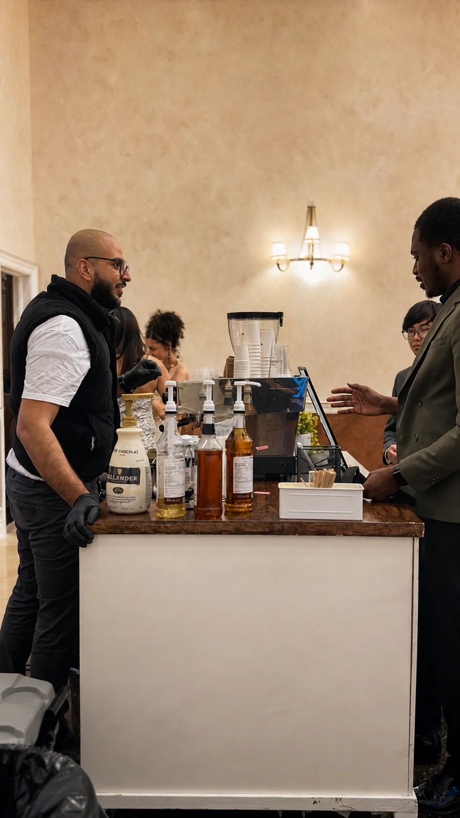 Guests gathered at a RoastAroma wedding coffee cart